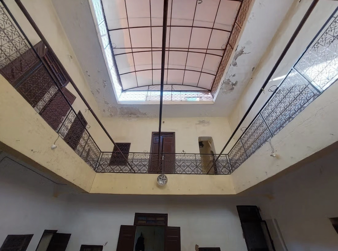 Unclear courtyard with metal railings in Rahba Kedima.
