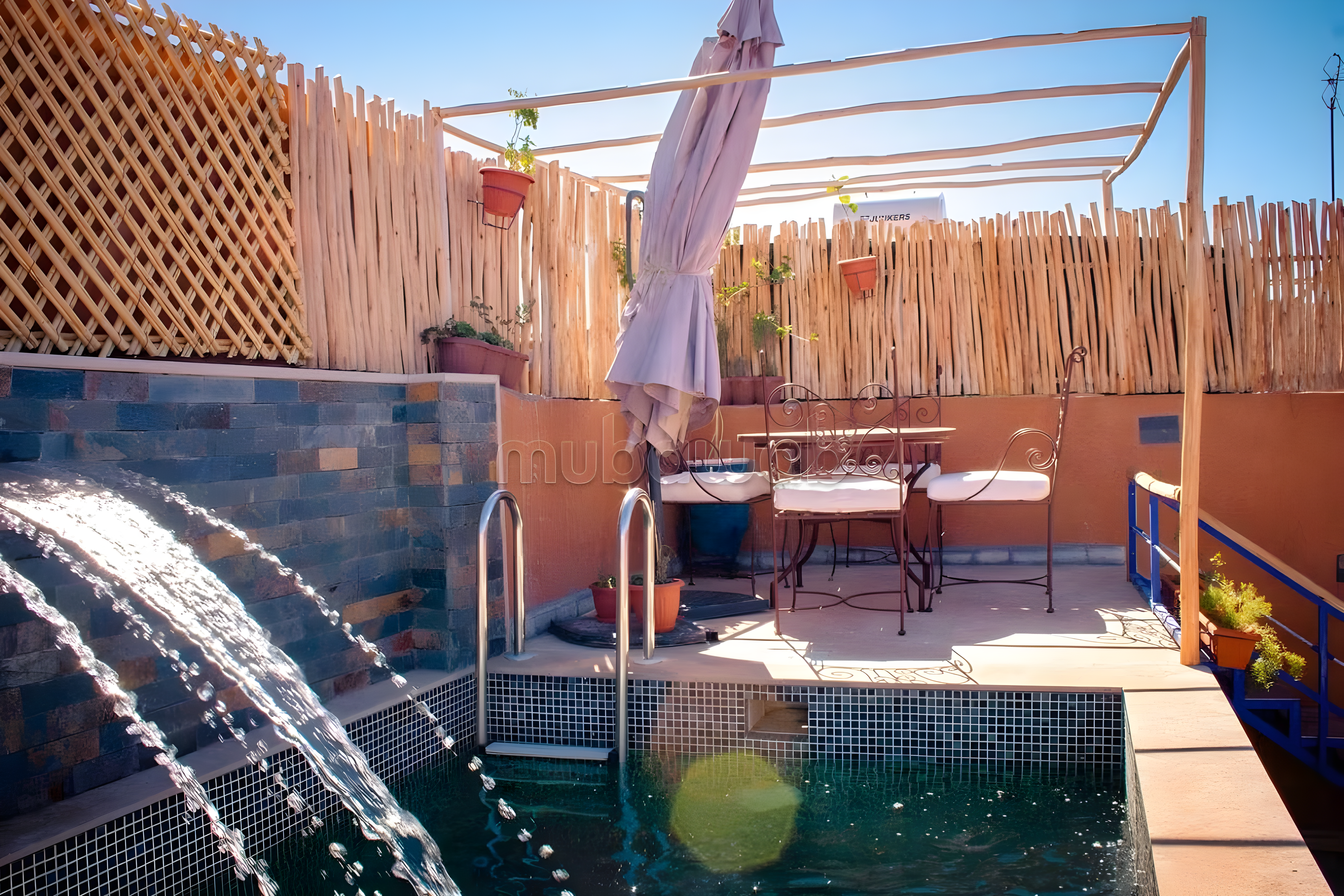 Terrace in Moulay Lyazid with pool and waterfall effect.