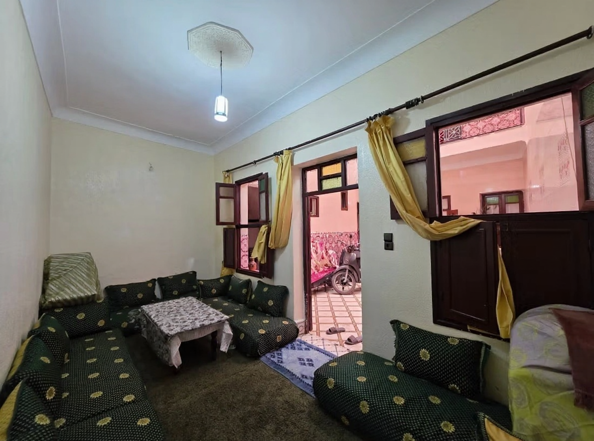 Moroccan salon with yellow curtains in Moulay Lyazid.
