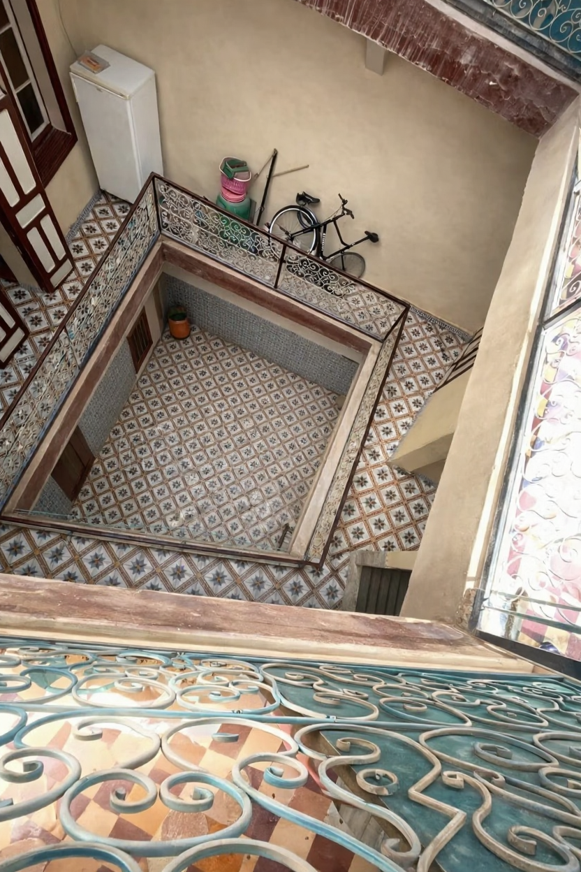 Unclear courtyard with tiles and wrought-iron railings in Ben Saleh.