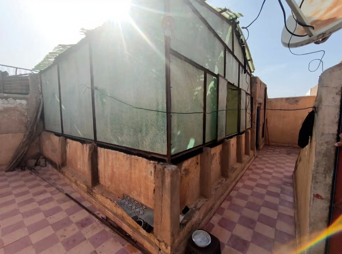 Rooftop in Assouel with translucent panels and tiled floor.