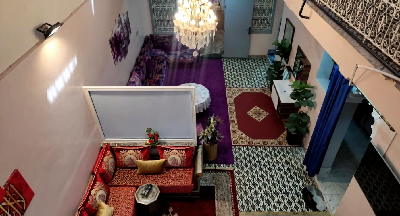 Moroccan salon with patterned flooring and a central chandelier in Berrima.