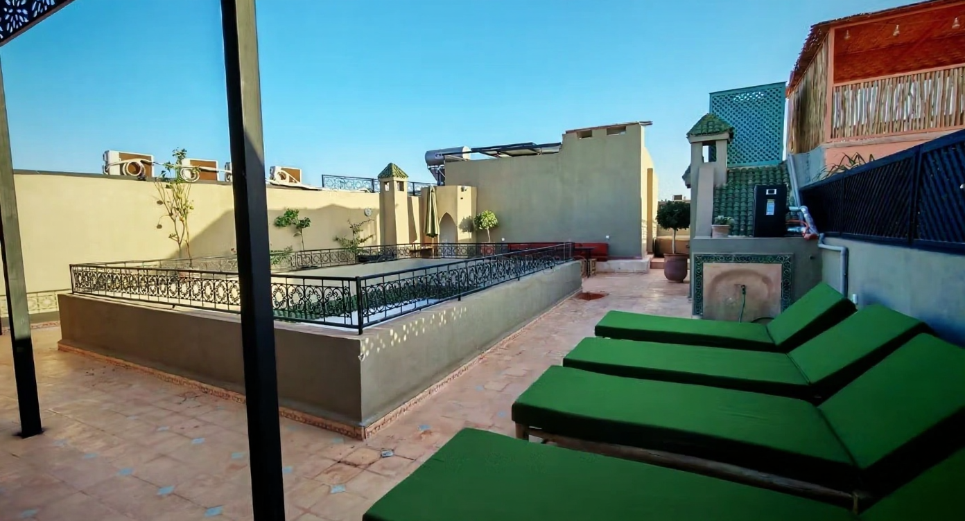 Rooftop lounge area with chairs in a guesthouse, Derb Chtouka.